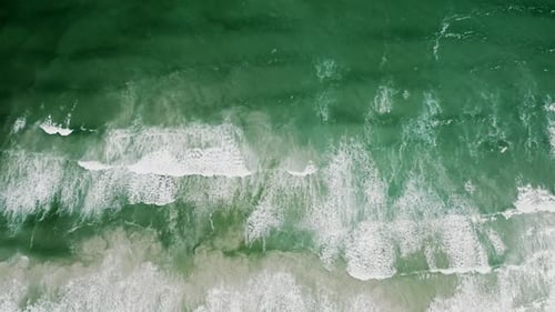 Ocean Waves Crashing the White Sand Beach