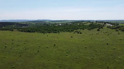 Aerial drone view of a flying over the rural agricultural landscape.