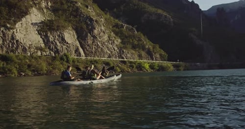 People Kayaking on a Beautiful Sunny River