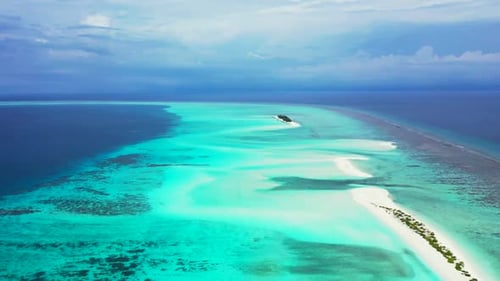 Aerial drone shot panorama of beautiful seashore beach holiday by turquoise lagoon and white sandy b