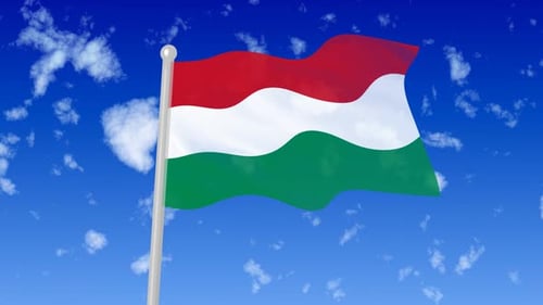 Waving Hungarian Flag on a Pole Against a Blue Sky