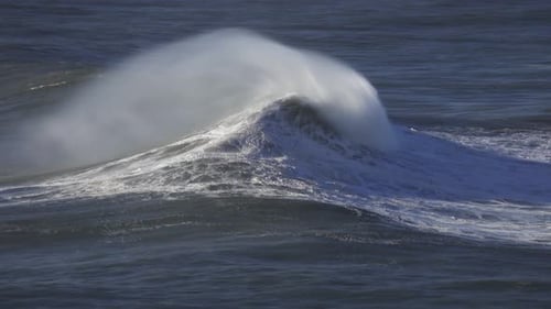 Large Wave Rolling on Surface of Stormy Ocean