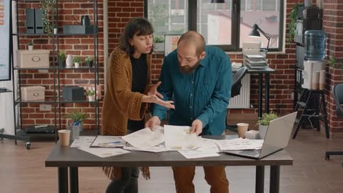 Furious Man Throwing Chart Papers in Air After Argument