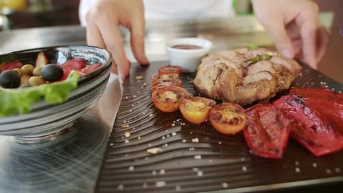 Chef Plates Dish in Restaurant Kitchen