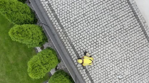 Aerial View of Construction Worker Paving Brick