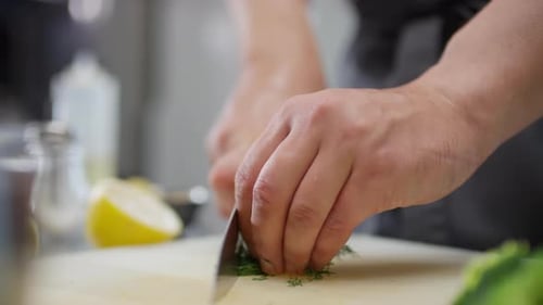 Chef Hands Cutting Fresh Dill