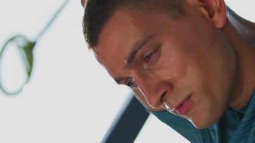 Man sweating during intense workout