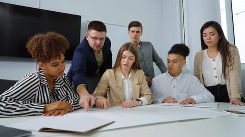 Designers team discussing masterplan in office