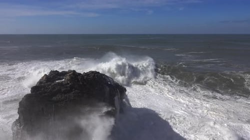 High Waves Breaking on the Rocks of the Coastline