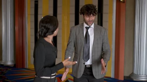Frustrated Woman Swats Away Talking Man
