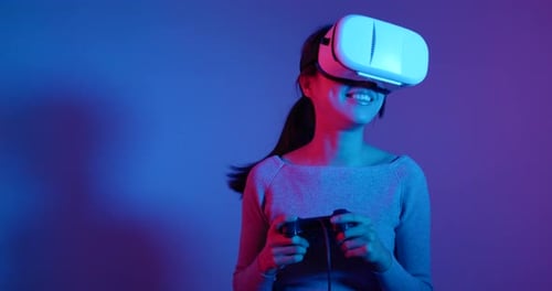 Woman Enjoys Virtual Reality Gaming with VR Headset