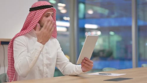 Man in Headscarf on Tablet Video Call