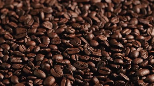 Pile of Rich Roasted Coffee Beans Close-up