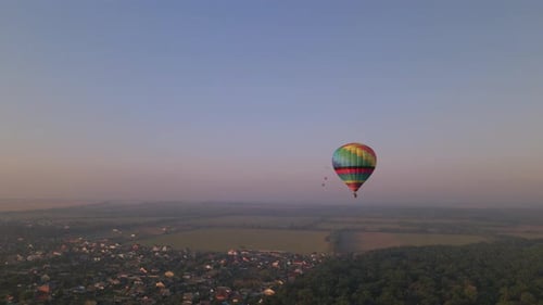Aerial Deone View of Colorful Air Balloon Flying Over Green Park and River in Small European City at