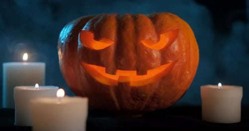 Festive Halloween Pumpkin with Candles at Night