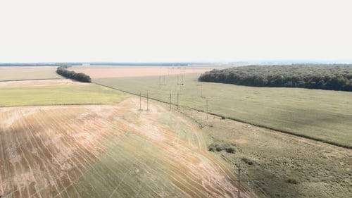 Aerial View of Rural Fields with Power Lines