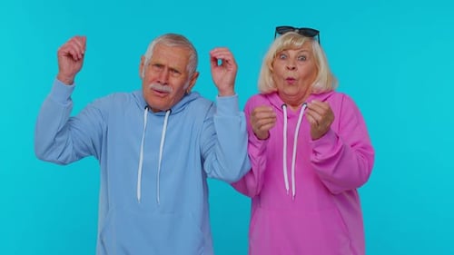 Shocked Senior Couple Reacting in Disbelief