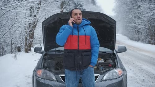 Man with Broken Down Car Calling for Help