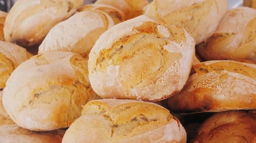 Freshly Baked Golden Bread Loaves Close Up