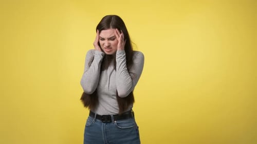 Woman Experiencing Headache Pain Touching Head
