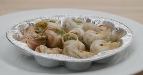 Cooked Snails Serving on a Plate