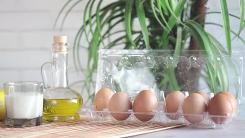 Kitchen Ingredients: Eggs, Milk, Oil, Lemon, Almonds