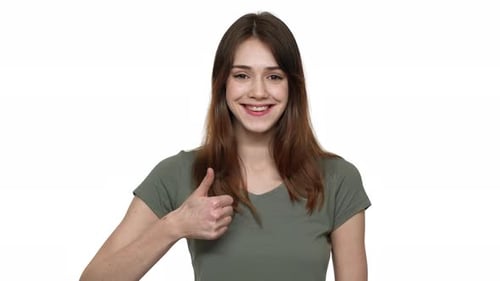 Young Woman Gives Thumbs Up Gesture