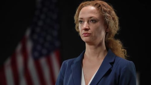 Confident Woman with American Flag Backdrop