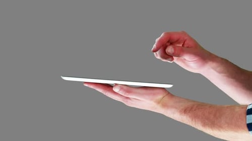 Hands Operating a Tablet Device Close Up