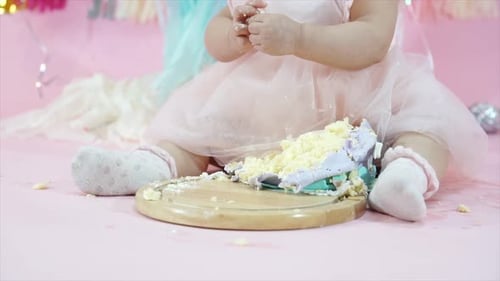 Baby Eats Cake at First Birthday Celebration