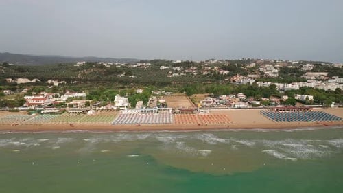 Aerial view of amazing beach with colorful umbrellas