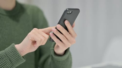 Close Up of Person Using Black Mobile Phone