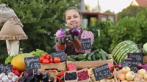 Teen Girl Offers To Buy Eggplants at the Farmers Market