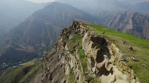 High green mountains with light fog on sunny day