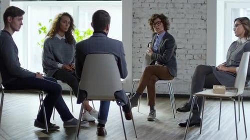 Therapy Session with Group of People in Office