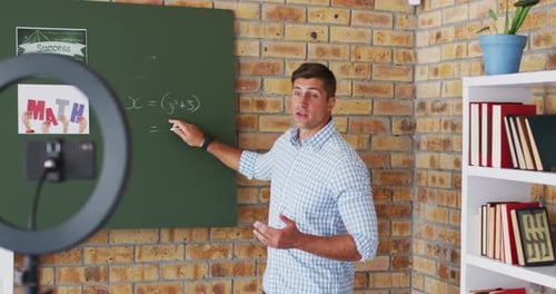 Energetic Man Explaining Math Problem On Chalkboard