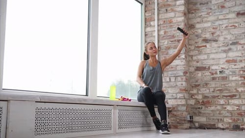 Young Woman Taking Selfie at the Gym
