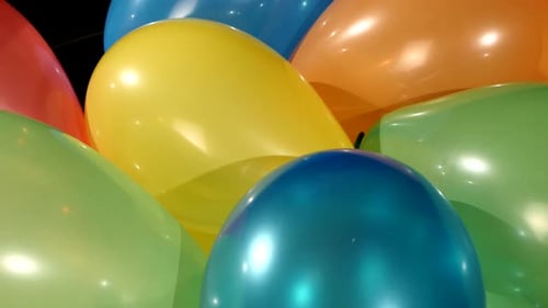 Different Multicolored Balloons, Rotation, on Black Background, Close Up