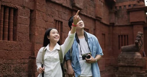 Couple takes a photo and visits ancient temple