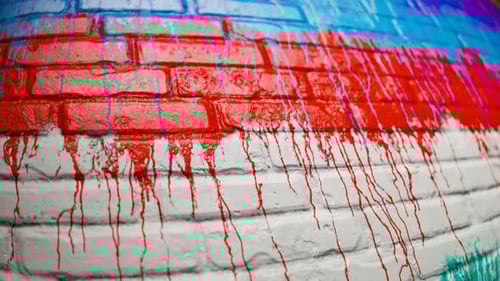 Vibrant Fluid Paint Drips on Textured Brick Wall