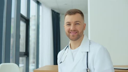 Portrait of a Private Practice Male Doctor in His Medical Office