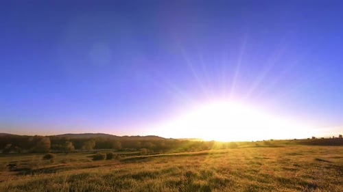 UHD Mountain Meadow Timelapse at the Summer. Clouds, Trees, Green Grass and Sun Rays Movement