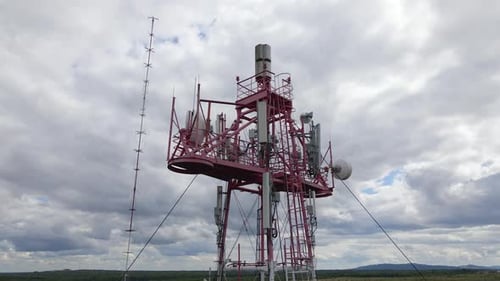 Aerial View of Telecommunications Cell Phone Tower with Wireless Communication Antennas for Network