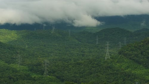 Wide Shot of Green Tropical Hills with Powerlines