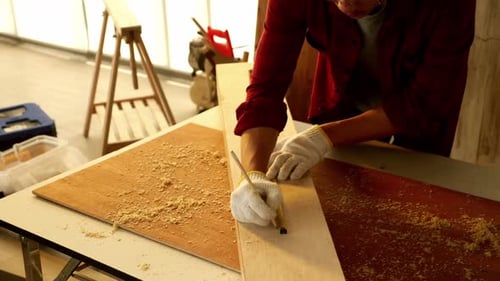 Woodwork and furniture making concept. Stylish craftsman working in his carpentry workshop