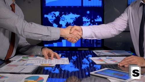 Businessmen Reviewing Financial Data in Modern Office