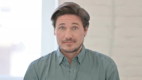 Close Up Portrait of Man Looking at Camera