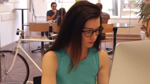 Woman Working on Computer in Office Environment