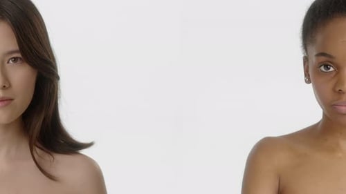 Two Elegant Women Posing With Bare Shoulders