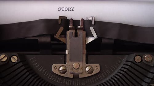 Typing word STORY on retro typewriter. Close up.